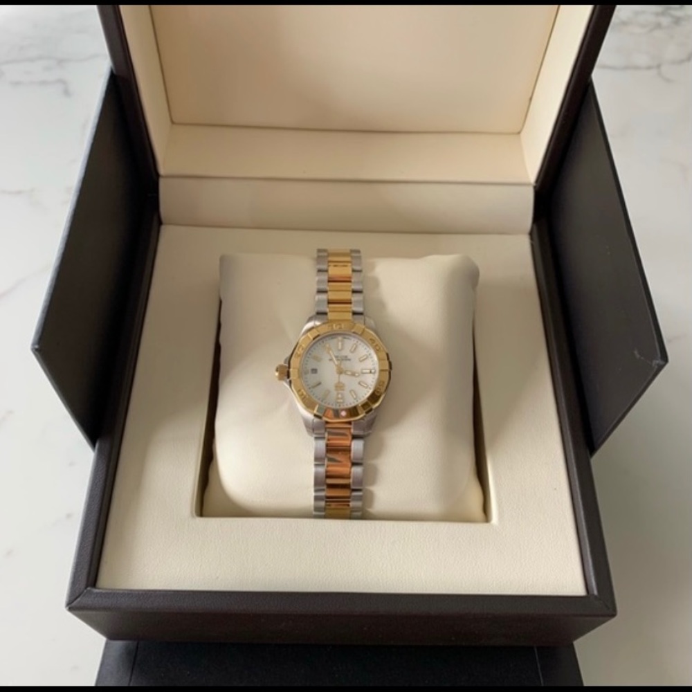 This is a brand new watch with gold and silver.